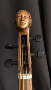 female carved head on a viola da braccio after Silvestro Ganassi