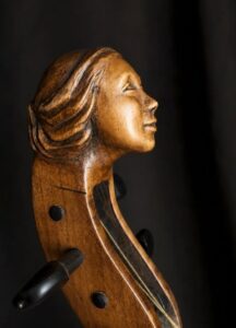 Carved female head for a viola da braccio