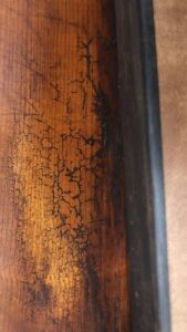 fine detail of antiqued crackle varnish on a baroque cello
